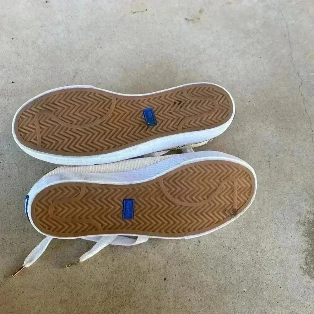 Keds beige canvas sneakers with black trim and leopard heel